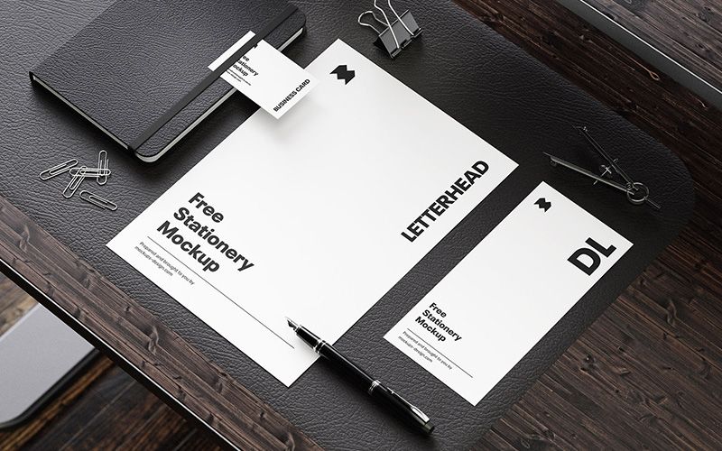 Free Stationery on the Wooden Desk Mockup 3