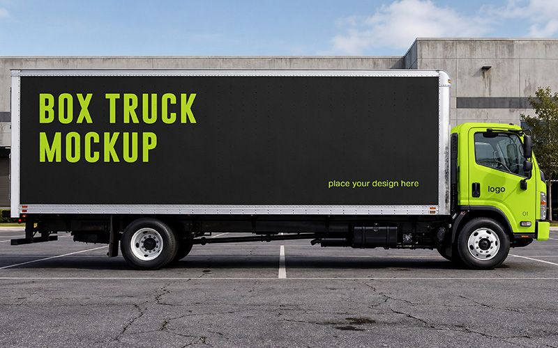 Free box truck mockup PSD with white delivery truck in warehouse parking lot for commercial vehicle branding.
