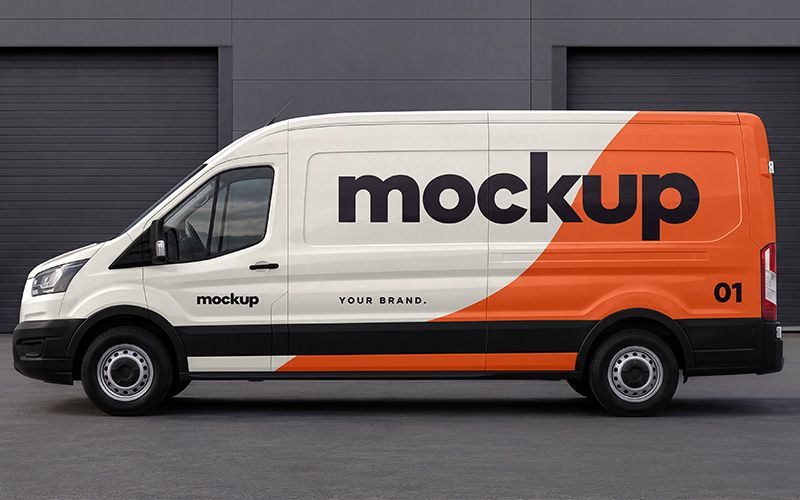 Cargo van mockup with orange and white branding in front of dark garage doors