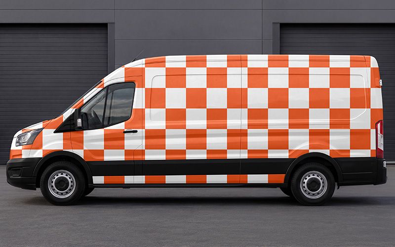 Orange and white checkered pattern showing artwork placement across the van body