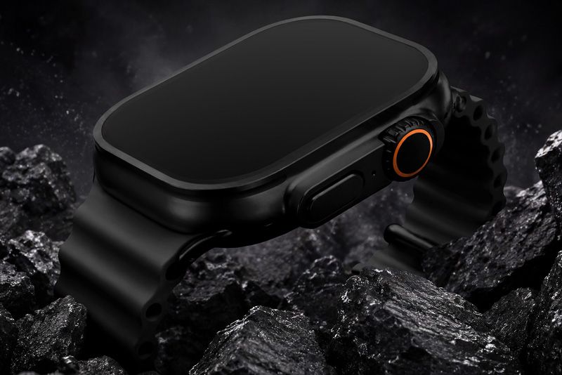 Black rugged smartwatch mockup with dark strap and orange crown detail in dramatic rocky product scene.