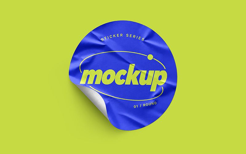 Wrinkled round sticker mockup with blue artwork, lime lettering, and a curled edge on a lime background