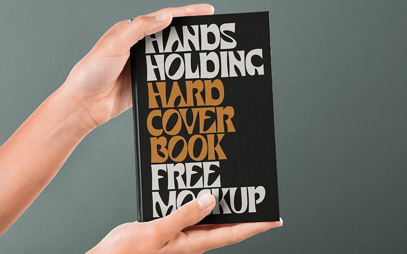 Free Hand Holding Hardcover Psd Book Mockup