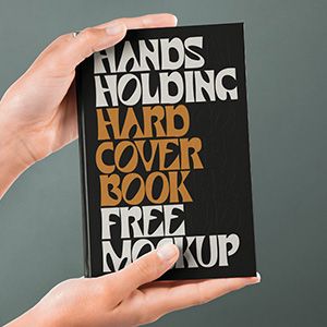 small_hand-holding-hardcover-psd-book-mockup-2