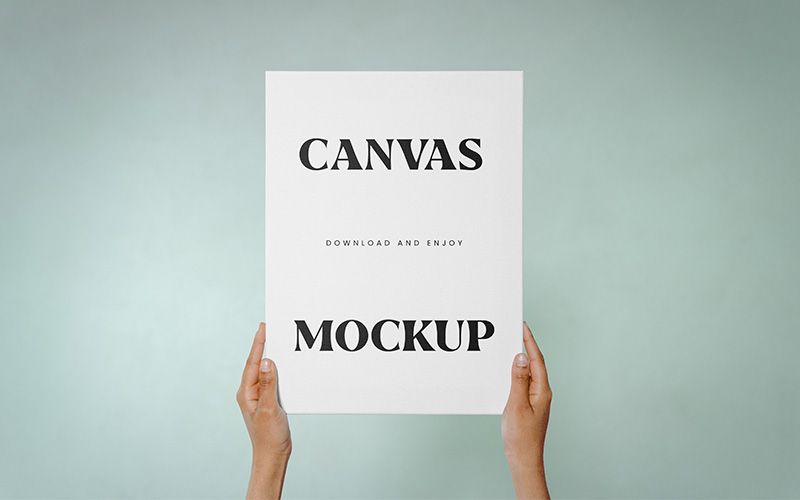 Free Canvas in Hands Mockup