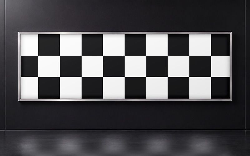 Horizontal lightbox mockup on a black wall with a checkerboard design and a soft floor reflection