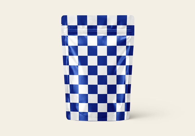 Stand up pouch with blue and white checkerboard artwork, front view on a cream background