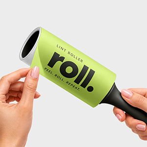 Free lint roller mockup with a lime green branded wrapper and black handle