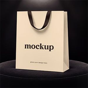 Luxury paper shopping bag mockup with ribbon handles for retail packaging and branding presentations